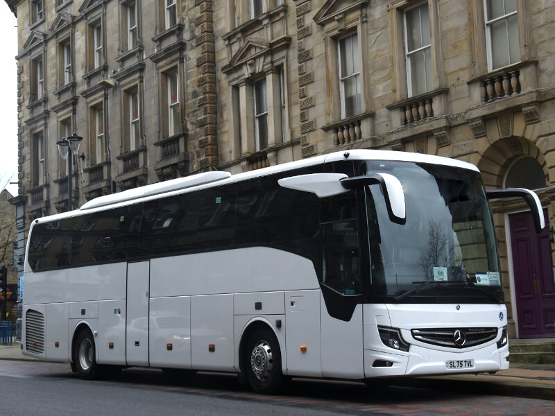 bus on road with driver