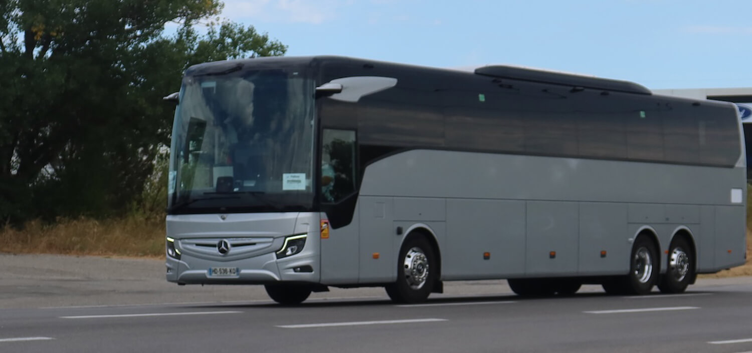 real french charter coach travel with group on road