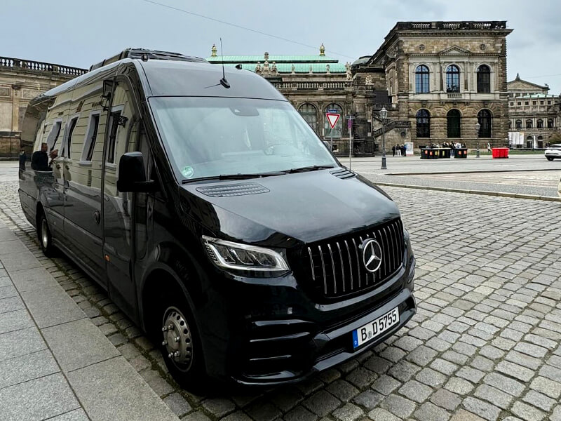 photo of minibus with driver front sprinter