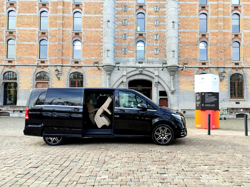 minibus in front of business building