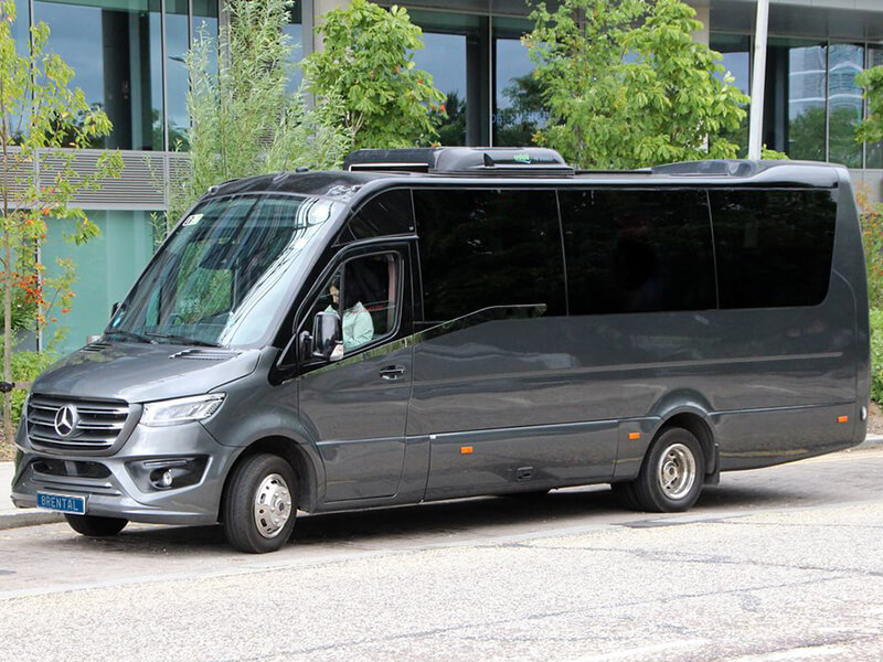 minibus with driver waiting passengers